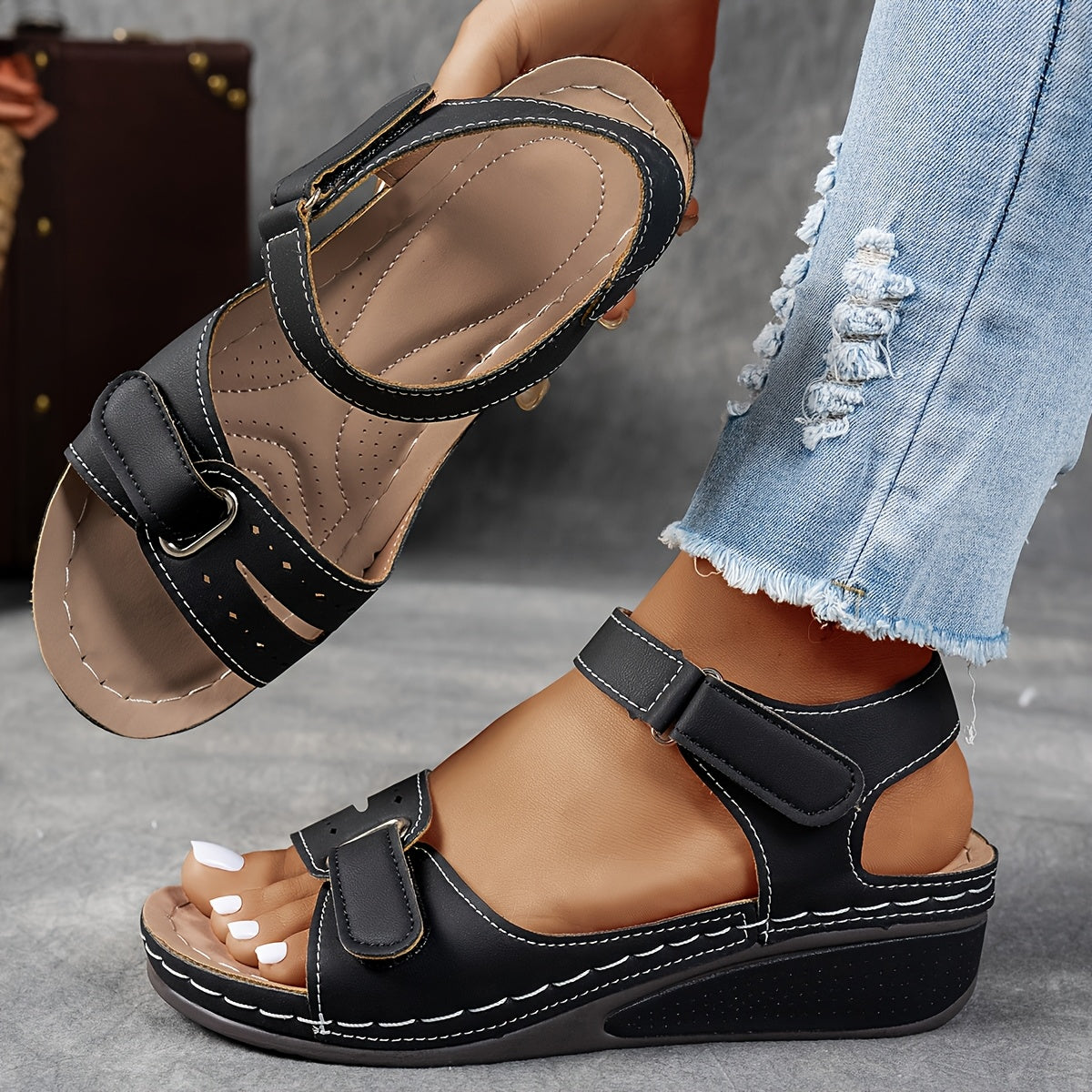 Black orthopedic comfort sandals with hook-and-loop straps and cushioned wedge sole