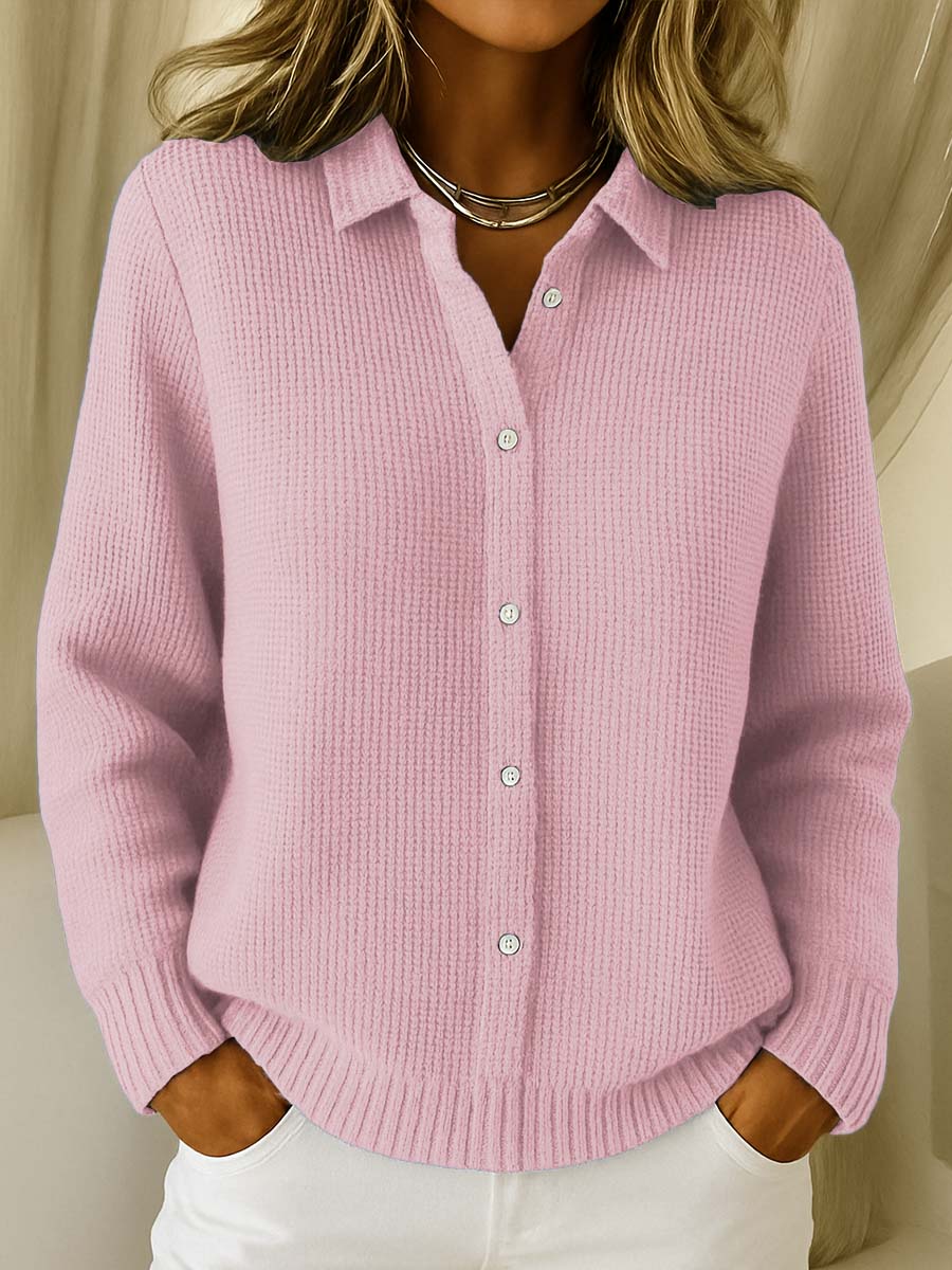Pink knit cardigan with collared button front and ribbed cuffs and hem.