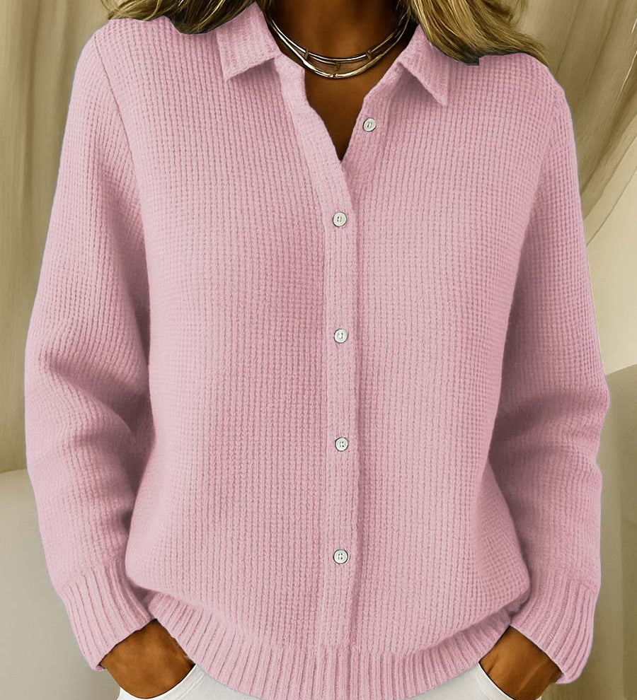Pink knit cardigan with collared button front and ribbed cuffs and hem.