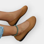Tan/brown knit slip-on ballet flats with rounded toe and flat sole