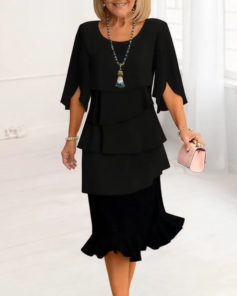 Black tiered ruffle midi dress with elbow-length cape sleeves and layered tiers