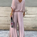 Two-piece chiffon set with backless V-neck blouse and wide-leg pants, dusty pink.