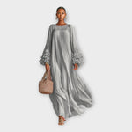 Long gray flowy maxi dress with gathered neckline and tiered ruffle sleeves