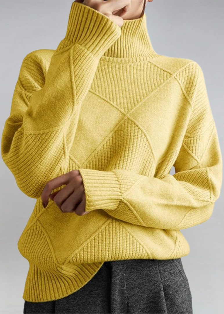 Yellow high-neck sweater with ribbed turtleneck and diagonal knit panel detail.
