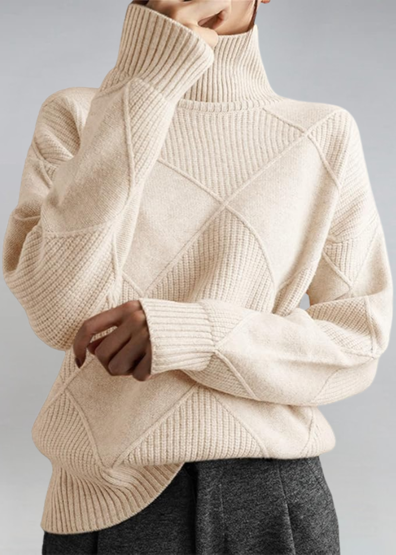 Cream high-neck sweater with ribbed turtleneck and diagonal knit panel detail.