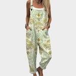 Loose printed overalls with green straps and full-body leaf pattern, sleeveless bib