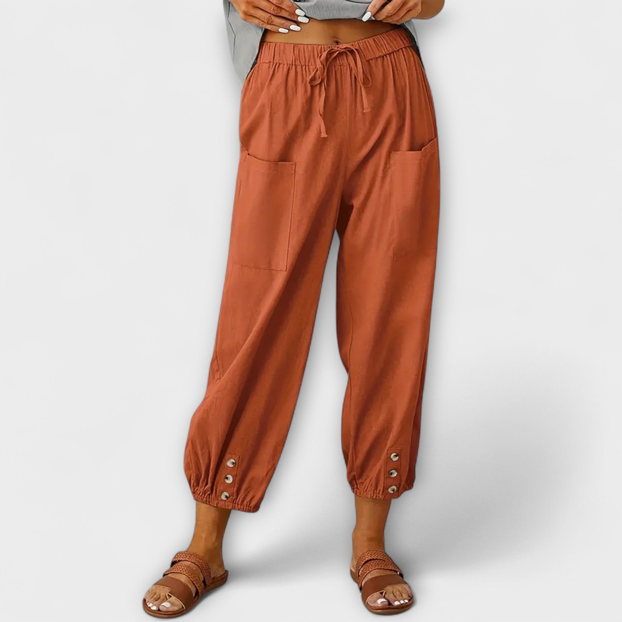 Rust brown harem pants with elastic waist and side cargo pockets