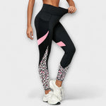 High-waist black leggings with leopard-print panels and pink accents