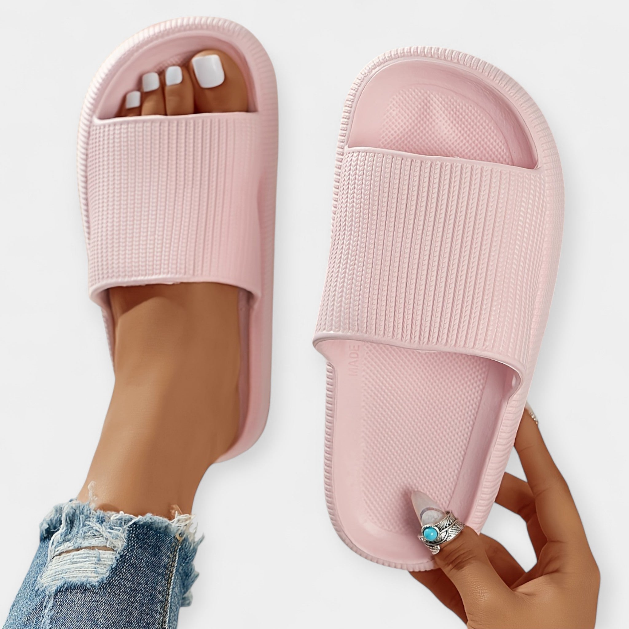 Soft pink slide sandals with ribbed footbed and wide open toe strap