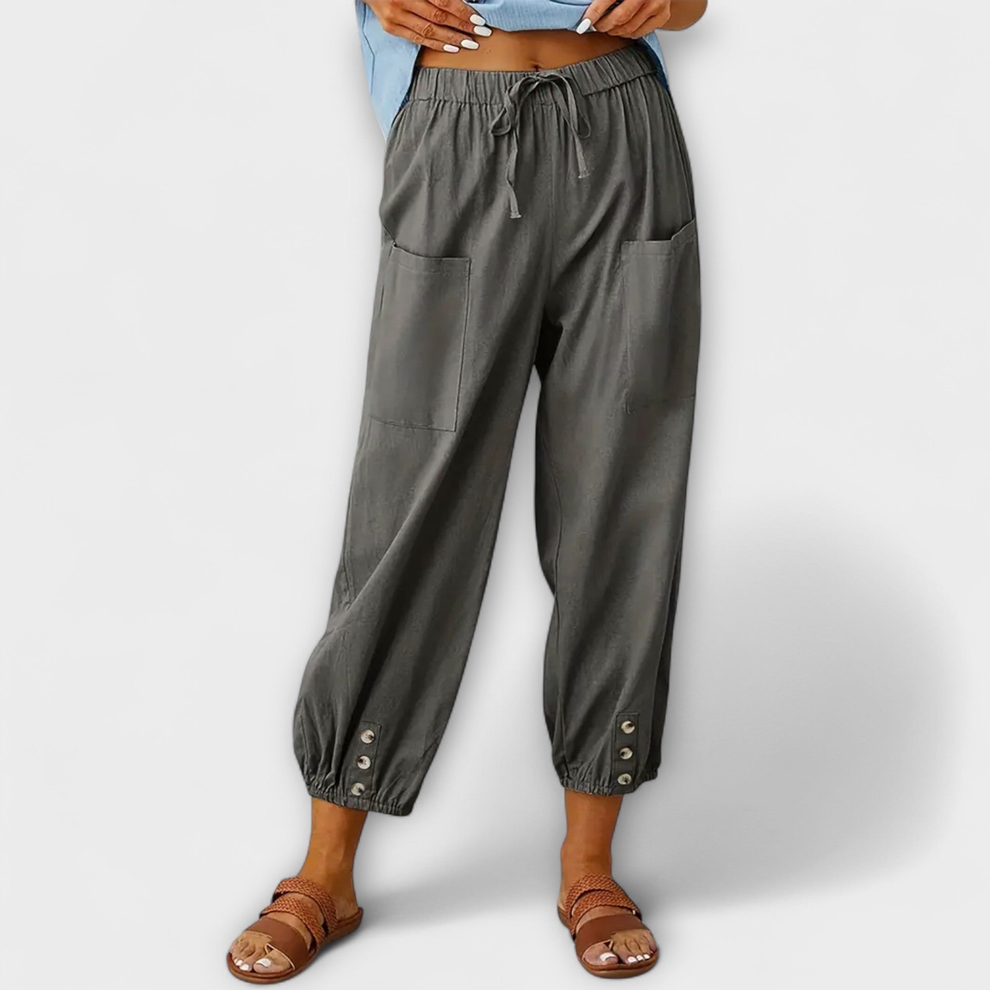 Dark gray harem pants with elastic waist and side cargo pockets