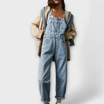 Light blue denim loose-fit overalls with adjustable straps and front bib pocket