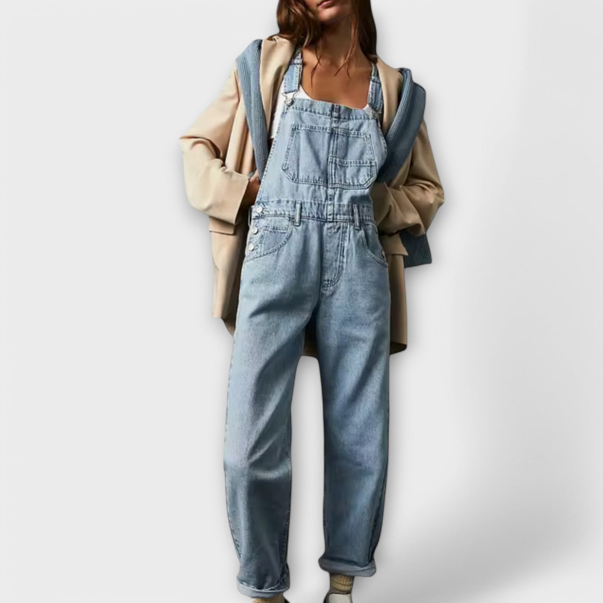 Light blue denim loose-fit overalls with adjustable straps and front bib pocket
