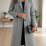 Women’s gray long tailored coat with notched lapels, front buttons, and side pockets