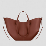 Large rust-brown tote bag with top handles and side loop straps, curved open shape