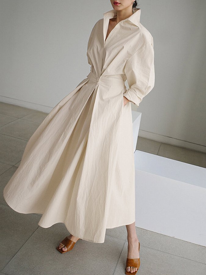 Beige long wrap-style dress with puff sleeves and tied waist, full skirt