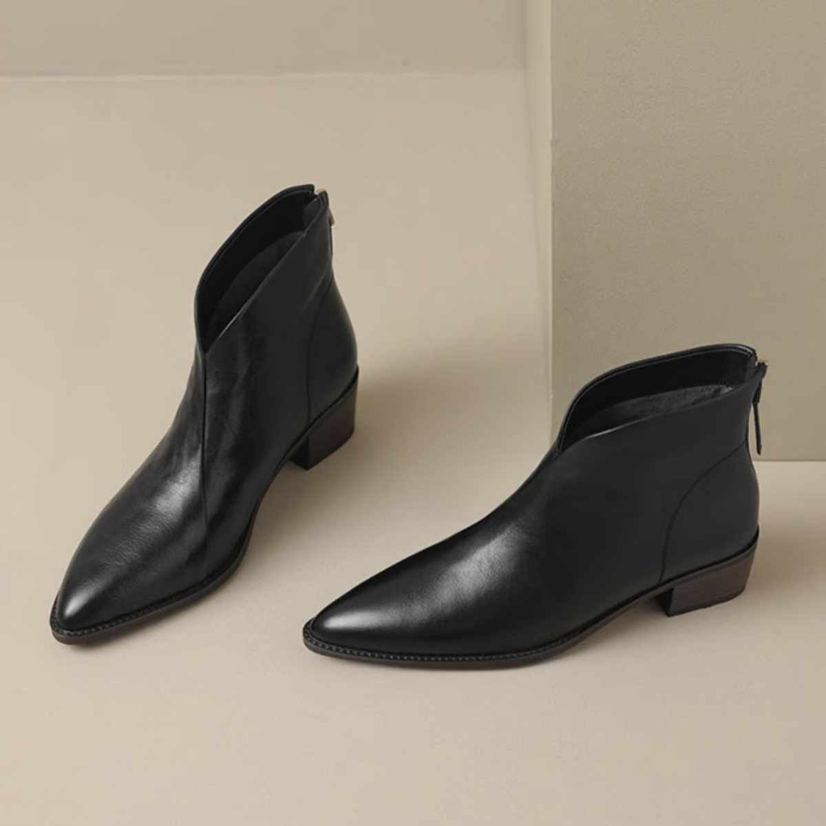 Black ankle boots with low block heel, side pull-on opening