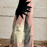 High-waist wide-leg boho pants, pink-green abstract print with large black starburst shapes