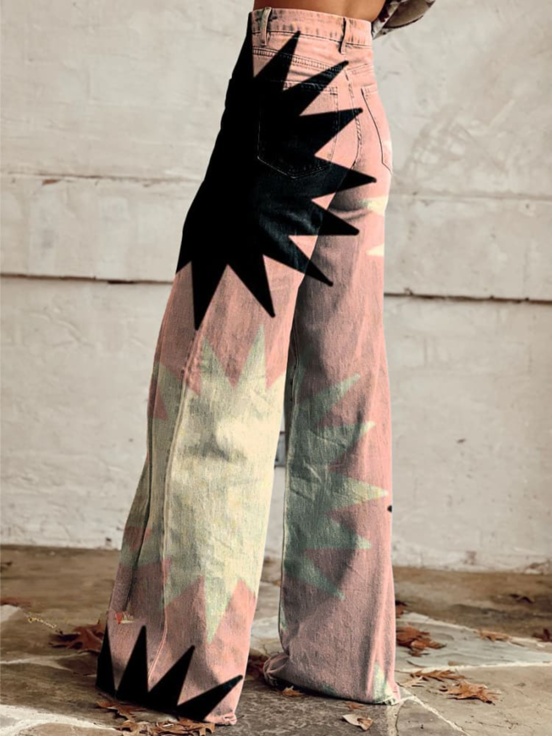 High-waist wide-leg boho pants, pink-green abstract print with large black starburst shapes