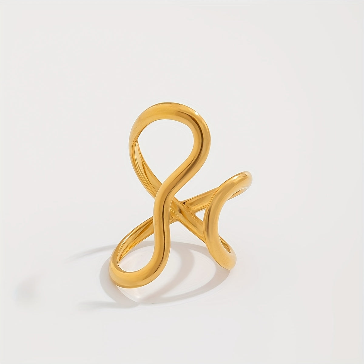 Gold-tone asymmetric wave statement ring with curled open-loop design