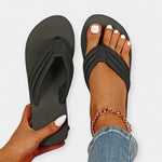 Black flip-flop sandals with textured thong strap, flat sole