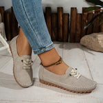 Beige suede-look slip-on loafer shoes with lace-up top and rubber tread sole