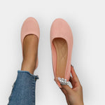 Pink knit slip-on ballet flats with rounded toe and flat sole