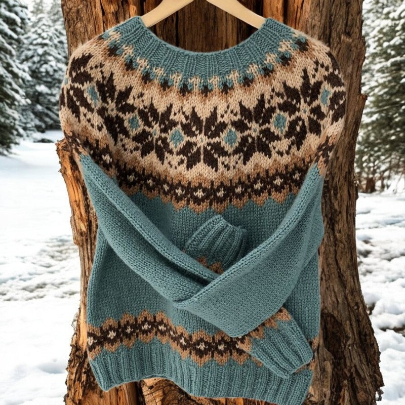 Teal Fair Isle knit sweater with round neck, long sleeves, patterned yoke and hem