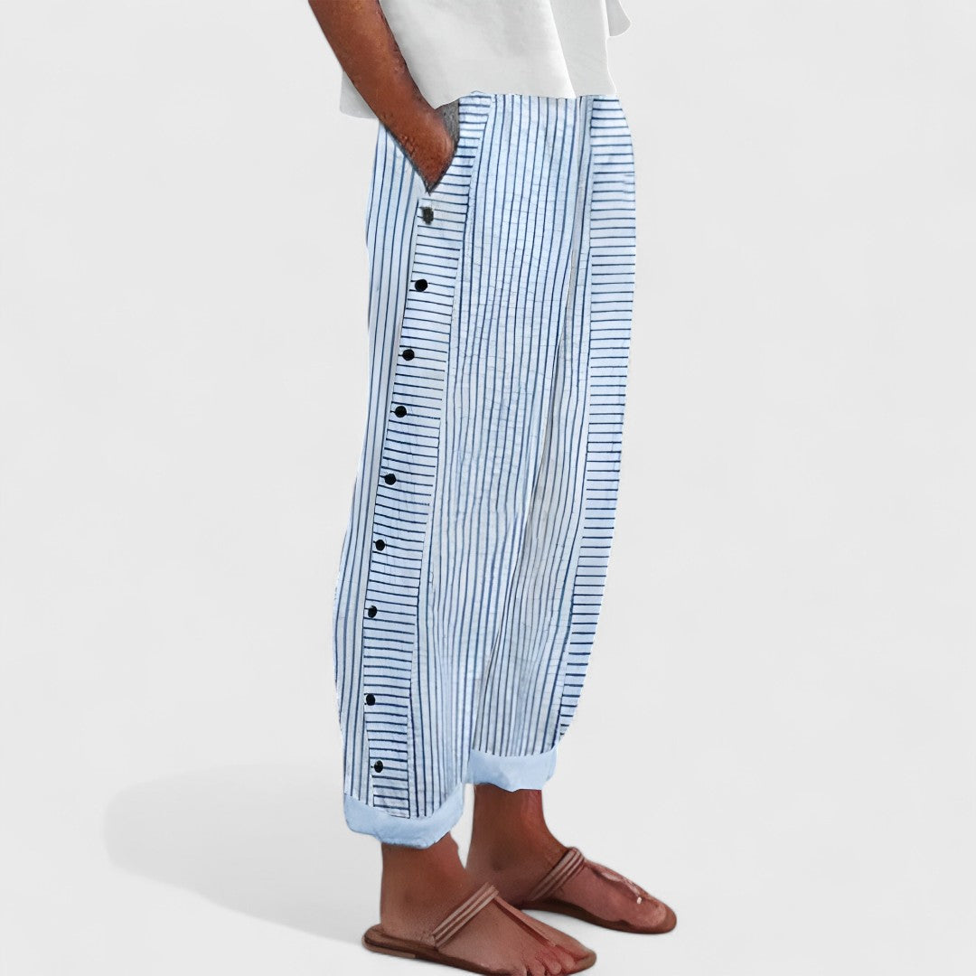 Light blue striped linen pants with side button placket and relaxed straight leg