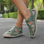 Lightweight summer sandals in green on feet with ankle chain detail
