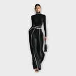 Women's turtleneck jumpsuit in black with contrast piping, wide-leg trousers, belt