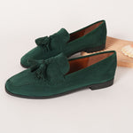 Green suede tassel loafers with slip-on design and round toe