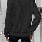 Black cable-knit zip-front sweater, back view, long sleeves with textured braid pattern.