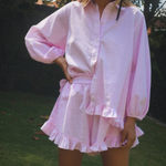 Pink button-up mini dress set with long puff sleeves and tiered ruffle skirt