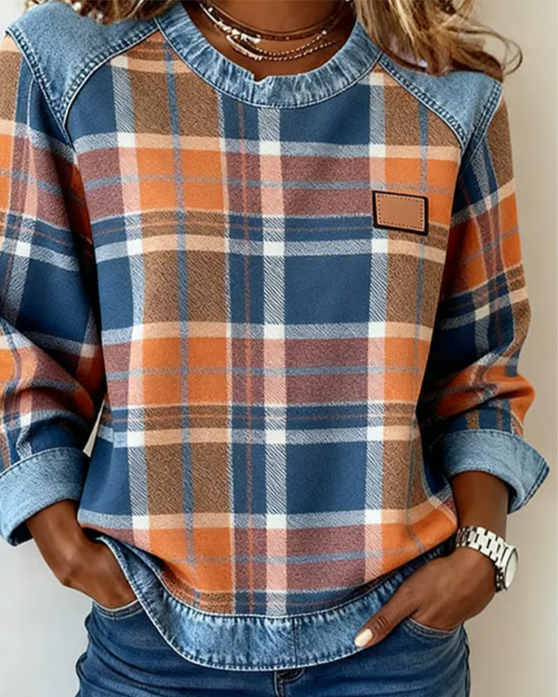 Women’s flannel pullover with plaid print, denim trim collar, and chest patch