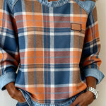 Women’s flannel pullover with plaid print, denim trim collar, and chest patch