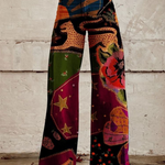 Patchwork boho wide-leg pants, colorful abstract pattern and floral accents