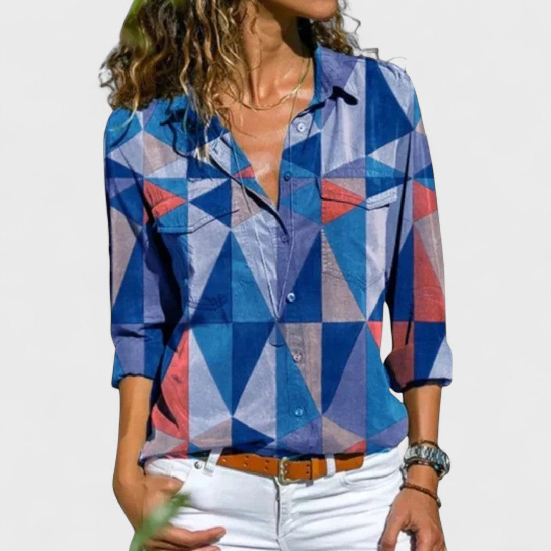 Elegant button-up blouse with blue, red, and white geometric triangle pattern, collared
