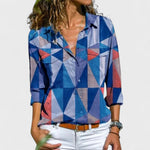 Elegant button-up blouse with blue, red, and white geometric triangle pattern, collared