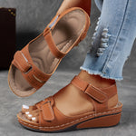 Tan/orange orthopedic comfort sandals with hook-and-loop straps and cushioned wedge sole