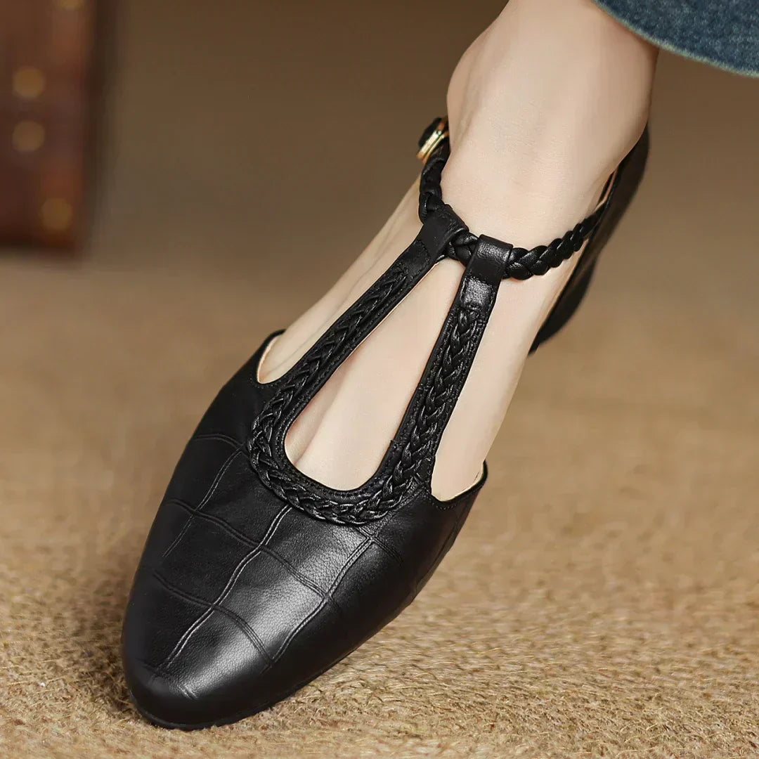 Black leather pointed-toe mary jane flats with braided strap detail