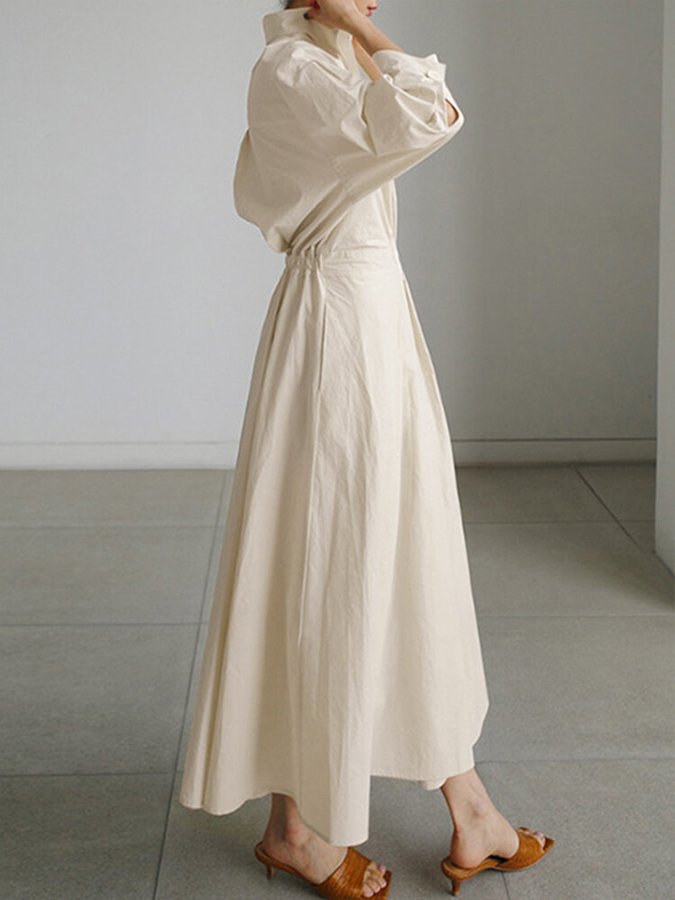 Beige long button-front dress with puff sleeves and waist tie, flowing A-line hem