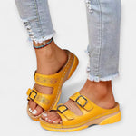 Pain-Free Support sandals in yellow with two buckled straps and perforated details on platform