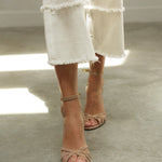 Light brown high-heel sandal with ankle strap and thin heel, open toe