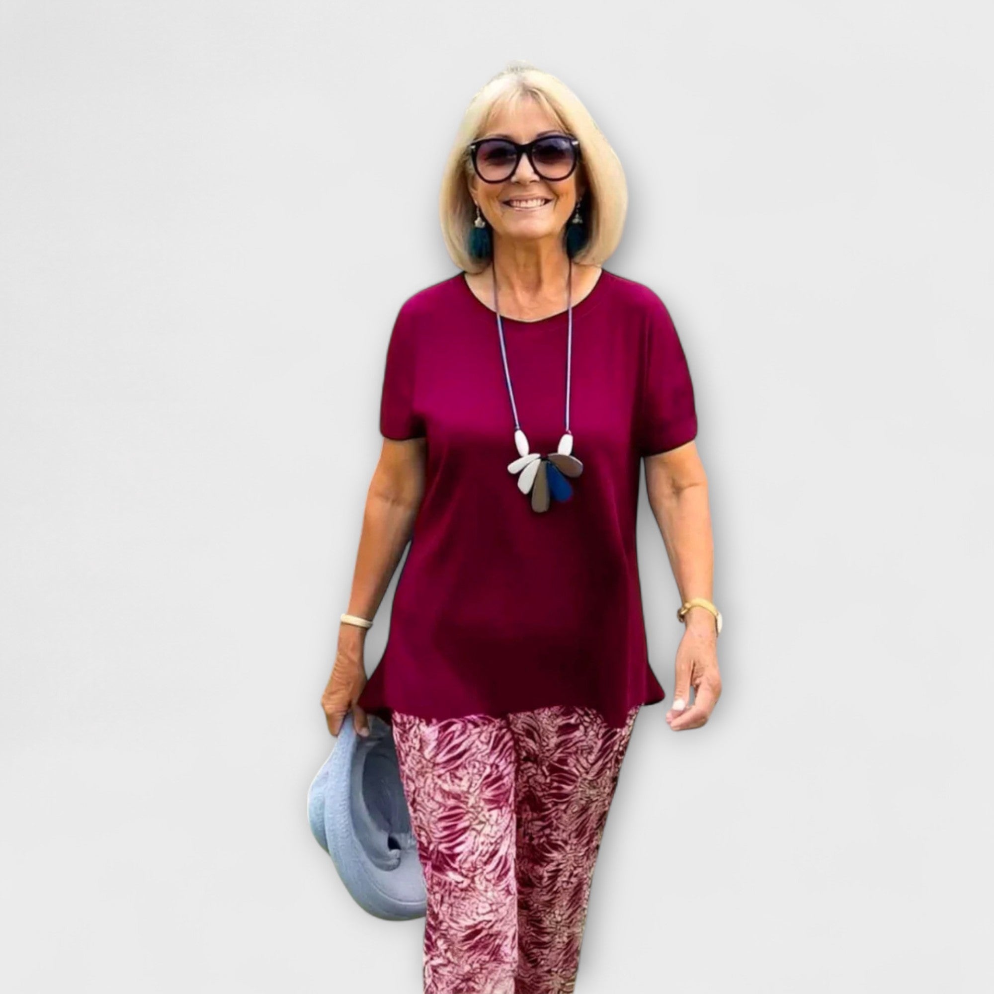 Elegant summer two-piece set: burgundy short-sleeve top and maroon-white patterned leggings