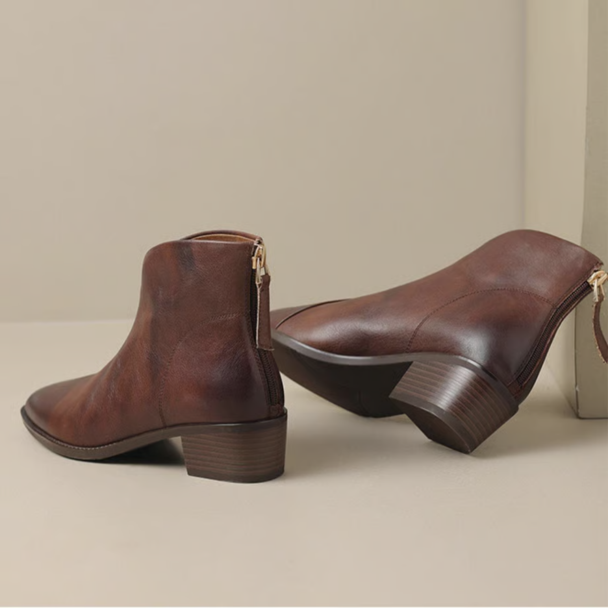 Brown ankle boots with low block heel and side zip closure