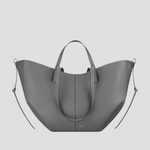 Large gray tote bag with top handles and side loop straps, curved open shape