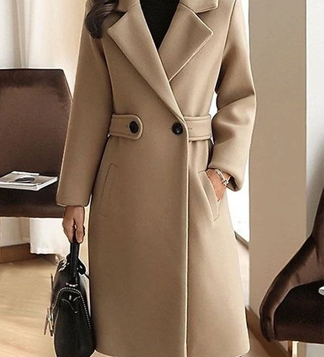 Beige winter coat with notch lapels, front buttons, and waist belt