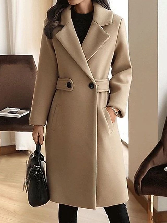 Beige winter coat with notch lapels, front buttons, and waist belt