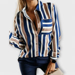 Striped button-up blouse with chest pocket, open collar, and long sleeves