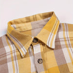 Yellow plaid long-sleeve button-up shirt with pointed collar and button front